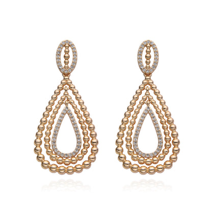 Aretes Lágrima Dorada en Capas